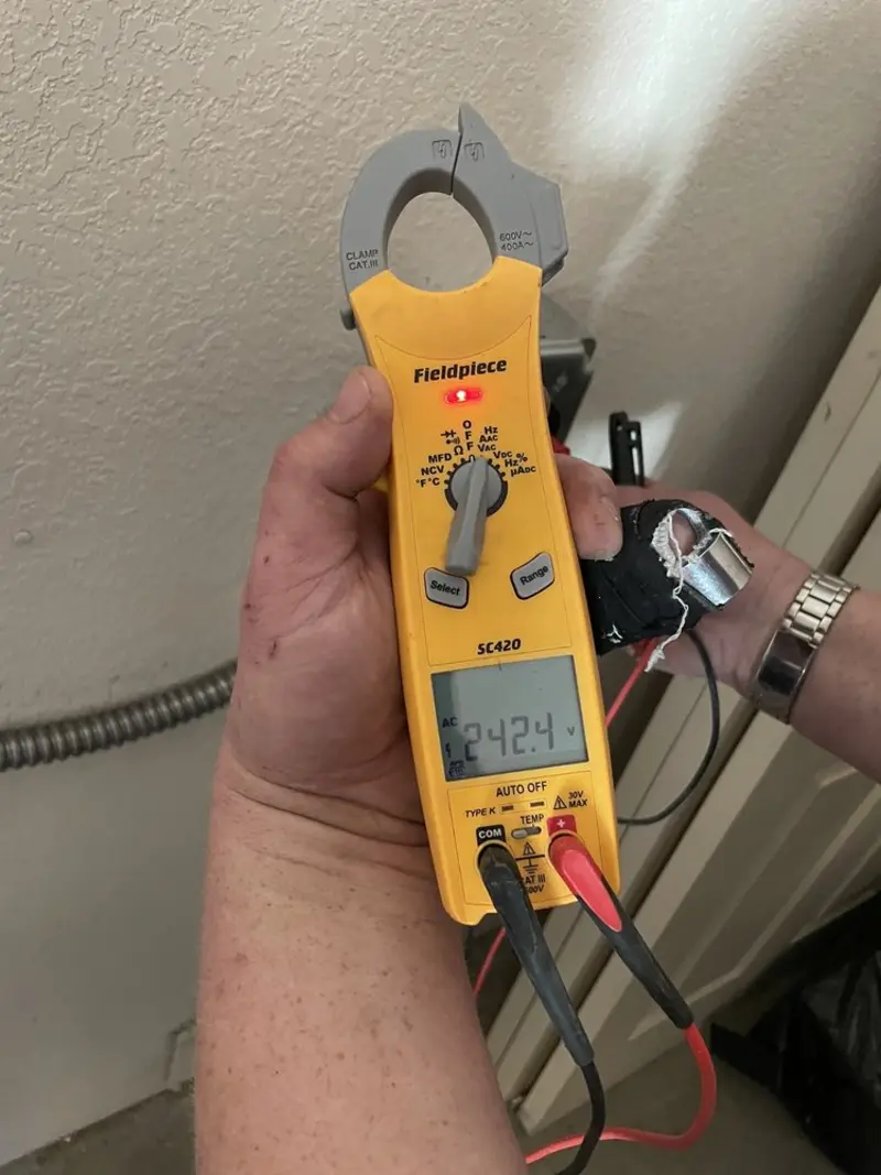 Voltage testing with clamp meter during Outlet Installation in North Reading